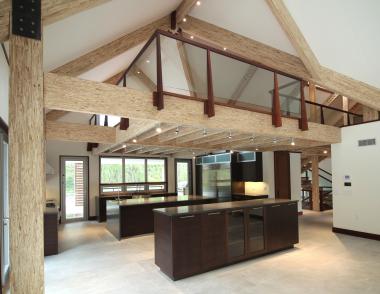 Exposed Engineered wood beams barn house interior