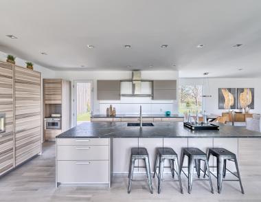 The pair of homes in the Seaview Development in East Hampton, N.Y., boast a similar modern-farmhouse vernacular, but subtle differentiations from the exterior materials to the sleek kitchen cabinets set each residence uniquely apart.