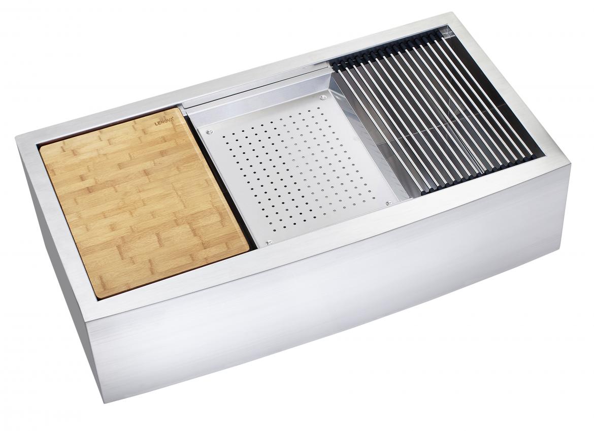 An apron-front sink from Lenova with a colander, grid drainer, and cutting board