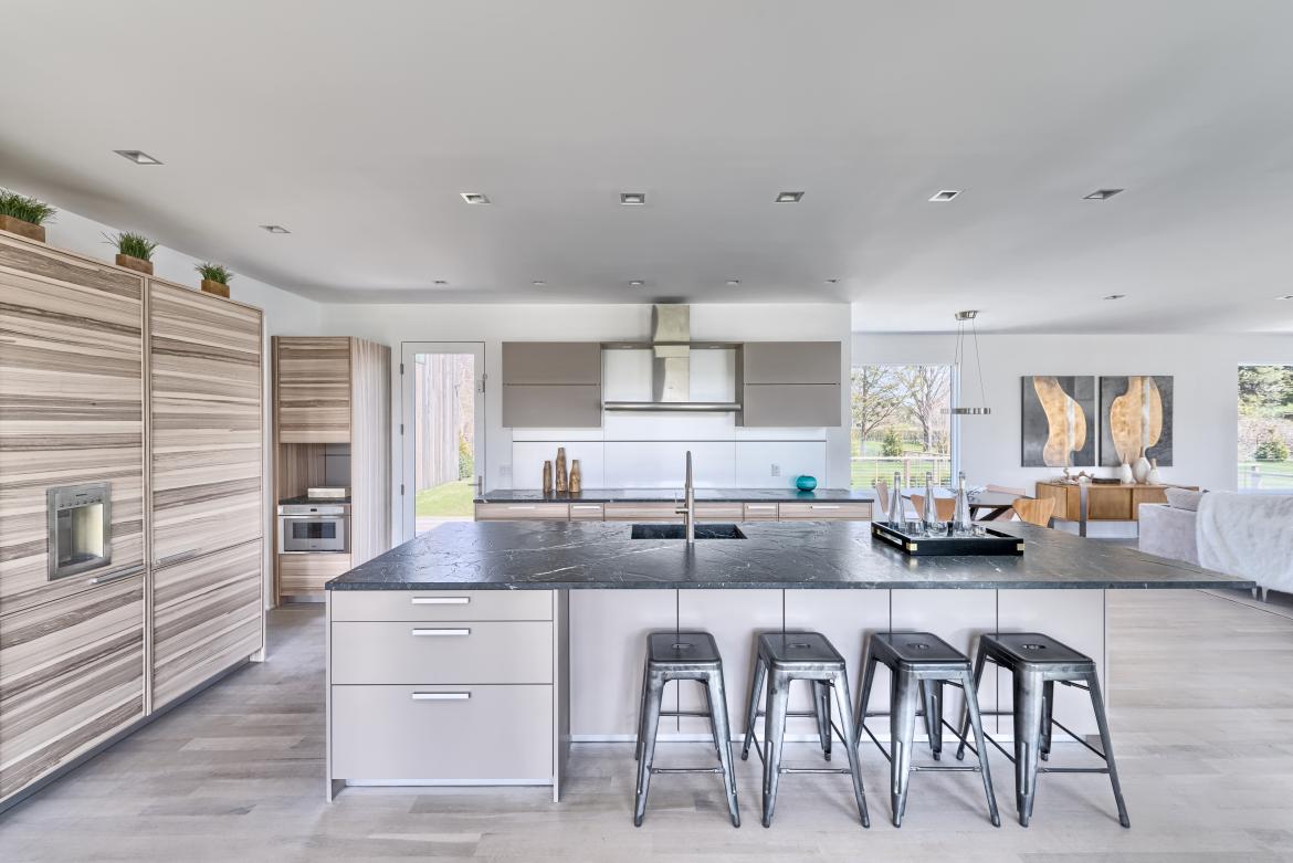 The pair of homes in the Seaview Development in East Hampton, N.Y., boast a similar modern-farmhouse vernacular, but subtle differentiations from the exterior materials to the sleek kitchen cabinets set each residence uniquely apart.