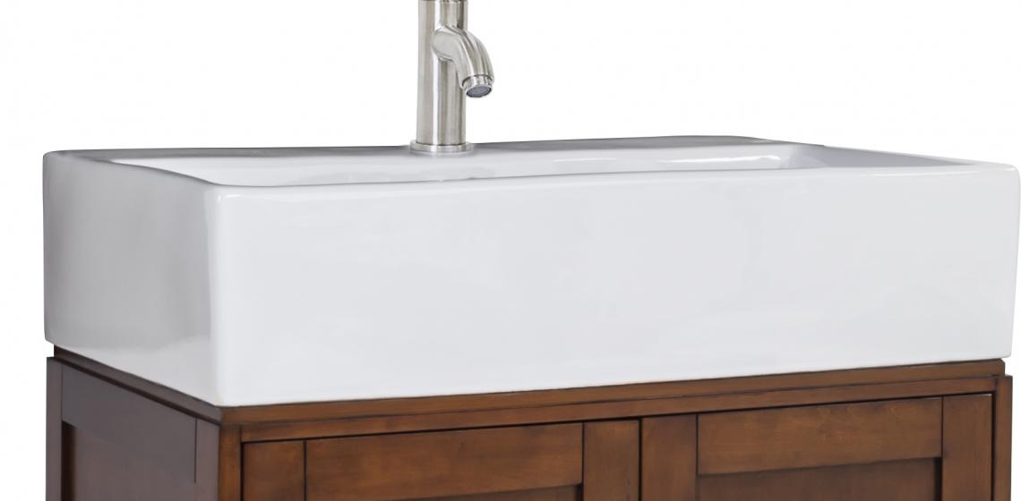Part of the Jeffrey Alexander collection, the York Vessel vanity features a large two-door cabinet and bottom drawer for storage. It measures 28 inches wide, 18¼ inches deep, and 36 inches tall. The product comes with an oversized vessel bowl/top cut for a single-hole faucet, coordinating glass mirror, and satin nickel hardware. It is available in chocolate and espresso finishes.