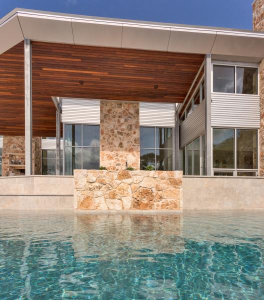 Petersen Aluminum Carson Design Associates Texas Hill Country Modern House View across the pool