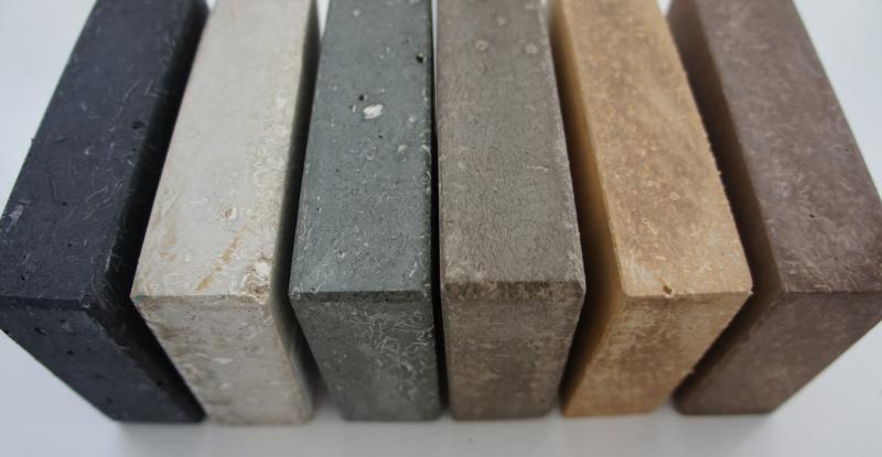 The manufacturer’s product is a fibrous-cement material comprised of recycled paper, recycled glass, and low-carbon cement. It is hand-cast into “slabs” as an alternative to natural or quarried stone and has the appearance of soapstone or limestone. 